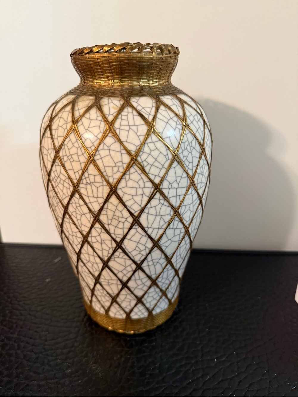 Japanese pottery vase craquelure glaze and a basketweave metal overlay.